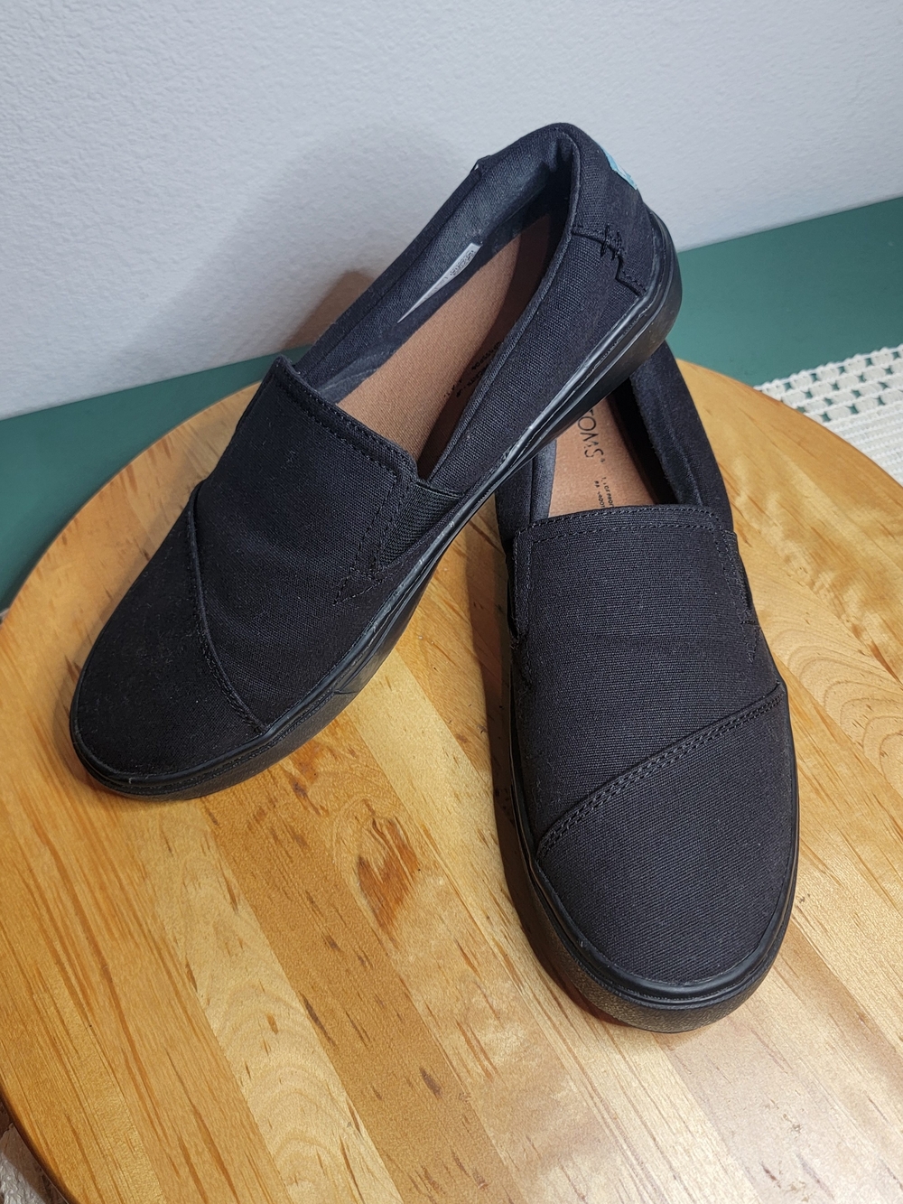 TOMS Alpargata slip-on shoes featuring a tonal black cups